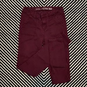 Plum colored skinny pants.